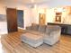 Modern living room features a comfortable couch, sliding barn door, and an open view into the kitchen at 7897 Hickory Ridge Ln, Mooresville, IN 46158