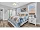 Spacious main bedroom with windows and stylish fan provides a peaceful retreat for homeowners at 7897 Hickory Ridge Ln, Mooresville, IN 46158