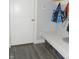 Cozy mudroom with a built-in bench, storage, and stylish gray wood-look flooring at 7897 Hickory Ridge Ln, Mooresville, IN 46158