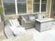 Relaxing covered patio with comfortable seating and a stylish outdoor fire pit at 7897 Hickory Ridge Ln, Mooresville, IN 46158