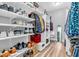 Spacious walk-in closet with shelves, hanging racks, and ample storage space at 7897 Hickory Ridge Ln, Mooresville, IN 46158