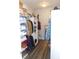 Spacious walk-in closet with wood floors, shelving and hanging storage at 7897 Hickory Ridge Ln, Mooresville, IN 46158