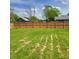 Fenced backyard with lush green grass, offering a secure and private outdoor space at 8136 E 37Th Pl, Indianapolis, IN 46226