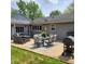 Outdoor patio area with dining and lounge seating, perfect for entertaining and relaxing outdoors at 8136 E 37Th Pl, Indianapolis, IN 46226