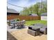 Backyard with a spacious patio area, comfortable seating, and a well-maintained lawn for outdoor enjoyment at 8136 E 37Th Pl, Indianapolis, IN 46226