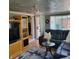 Comfortable living room with a large sectional sofa, modern decor, and hardwood floors at 8136 E 37Th Pl, Indianapolis, IN 46226