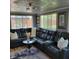 Spacious living room with a sectional sofa, stylish decor, and lots of natural light at 8136 E 37Th Pl, Indianapolis, IN 46226