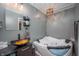 Modern bathroom featuring a soaking tub and updated fixtures at 8245 Woodlawn Dr, Martinsville, IN 46151