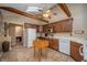 Bright kitchen with oak cabinets, white appliances, tile floors, and a butcher block island at 8245 Woodlawn Dr, Martinsville, IN 46151