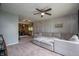 Cozy living room with a large sectional sofa, ceiling fan, and decorative accents at 8245 Woodlawn Dr, Martinsville, IN 46151