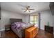 Comfortable main bedroom with wood floors, ceiling fan, and plenty of natural light at 8245 Woodlawn Dr, Martinsville, IN 46151