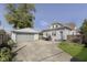 Charming backyard featuring a detached garage, patio, and a well-maintained lawn at 825 Iowa St, Indianapolis, IN 46203