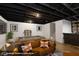 Finished basement recreation area featuring pool table, sofa, bar, and hardwood-style floors at 825 Iowa St, Indianapolis, IN 46203