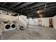 Unfinished basement with washer, dryer, painted ceiling, and stair access to upper level at 825 Iowa St, Indianapolis, IN 46203