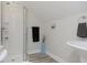 Clean and simple bathroom featuring a shower, vanity, and tasteful decorations at 825 Iowa St, Indianapolis, IN 46203