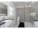 Modern bathroom with a walk-in shower, stylish tile flooring, and sleek fixtures at 825 Iowa St, Indianapolis, IN 46203