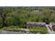 Aerial view of townhomes surrounded by lush green trees at 877 Rosalind Pl, Carmel, IN 46032