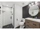 Modern bathroom with a glass-enclosed shower featuring hexagon tile, a modern vanity, and updated fixtures at 877 Rosalind Pl, Carmel, IN 46032