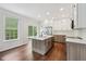 Spacious kitchen with large island, stainless steel appliances, and a sliding glass door at 877 Rosalind Pl, Carmel, IN 46032