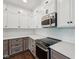 Modern kitchen showcasing stainless steel appliances, granite countertops, and stylish white backsplash at 877 Rosalind Pl, Carmel, IN 46032