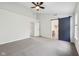 Main bedroom features an ensuite bathroom, ceiling fan, and neutral carpet at 877 Rosalind Pl, Carmel, IN 46032