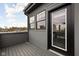 Private balcony area with gray siding and a glass-paned door at 904 Veterans Way, Carmel, IN 46032