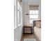 A corner view in the bedroom highlighting a window, side table, and neutral décor at 904 Veterans Way, Carmel, IN 46032