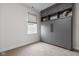 Modern bedroom with a built-in Murphy bed and gray cabinets at 904 Veterans Way, Carmel, IN 46032