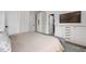 Bedroom view showcasing built-in storage and neutral wall tones at 904 Veterans Way, Carmel, IN 46032