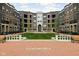 Beautiful courtyard view with fountain and benches surrounded by brick buildings at 904 Veterans Way, Carmel, IN 46032