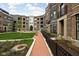 Exterior view of courtyard with a fountain, benches, and manicured landscaping at 904 Veterans Way, Carmel, IN 46032