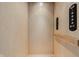 Wood paneled elevator featuring mounted handrail and access buttons at 904 Veterans Way, Carmel, IN 46032