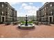 Central fountain and community gathering area with brick paving at 904 Veterans Way, Carmel, IN 46032