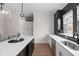 Contemporary kitchen showcasing a dark kitchen island and white countertops at 904 Veterans Way, Carmel, IN 46032