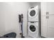 Convenient laundry room with stacked washer and dryer, and storage at 904 Veterans Way, Carmel, IN 46032