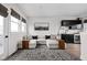 Bright living room with stylish sectional, unique rug, and wet bar with mini fridge at 904 Veterans Way, Carmel, IN 46032