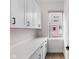 Pantry with white cabinets and light countertop by window at 904 Veterans Way, Carmel, IN 46032