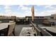 Spacious rooftop deck with a dining table, lounge seating, and neighborhood views at 904 Veterans Way, Carmel, IN 46032