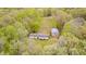 An aerial view of a beautiful property with long drive and home surrounded by greenery at 9660 B Old Haggard Rd, Morgantown, IN 46160