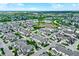 Aerial shot of a residential community near a tranquil lake, providing scenic views and a serene atmosphere at 9713 Springcress Dr, Noblesville, IN 46060