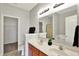 Bright bathroom with double vanity, large mirror, and separate closet space at 9713 Springcress Dr, Noblesville, IN 46060