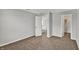 Bedroom with neutral paint, carpet flooring, and an open door to a walk-in closet at 9713 Springcress Dr, Noblesville, IN 46060