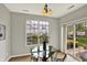 Bright dining area with natural light, stylish table, and sliding door at 9713 Springcress Dr, Noblesville, IN 46060