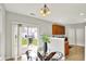 Cozy dining area with glass table, backyard view, and modern chandelier at 9713 Springcress Dr, Noblesville, IN 46060