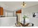 Open floorplan dining room featuring pendant lighting, access to kitchen, and view of the backyard at 9713 Springcress Dr, Noblesville, IN 46060