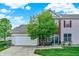 Charming two-story home featuring brick accents, neutral siding, and a well-manicured front lawn at 9713 Springcress Dr, Noblesville, IN 46060