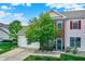 Charming two-story home featuring brick accents, neutral siding, and a well-manicured front lawn and landscaping at 9713 Springcress Dr, Noblesville, IN 46060