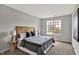Relaxing main bedroom featuring neutral decor, modern accents, and natural light at 9713 Springcress Dr, Noblesville, IN 46060