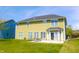 The backyard features a grass lawn with an outdoor seating area, perfect for enjoying time outside at 9993 Pepper Tree Ln, Noblesville, IN 46060