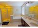 Well-lit main bathroom with a double vanity, a soaking tub, and a separate glass-enclosed shower at 9993 Pepper Tree Ln, Noblesville, IN 46060
